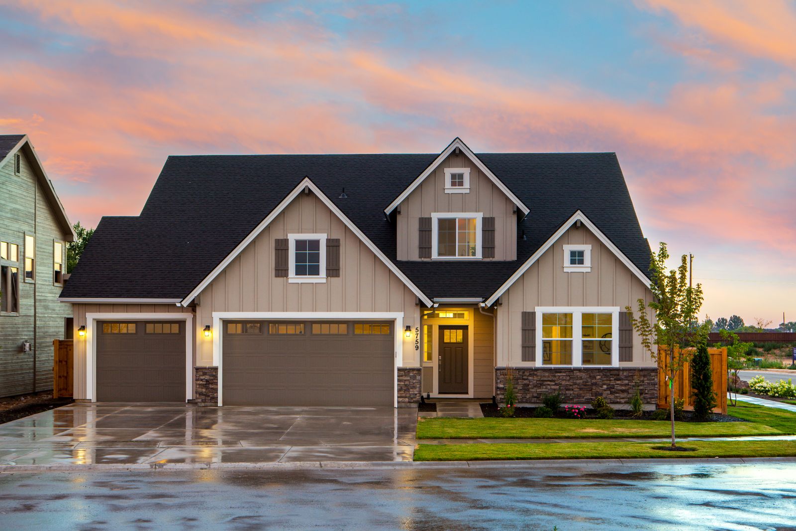 Craftsman home at dusk with a new architectural shingle roof
