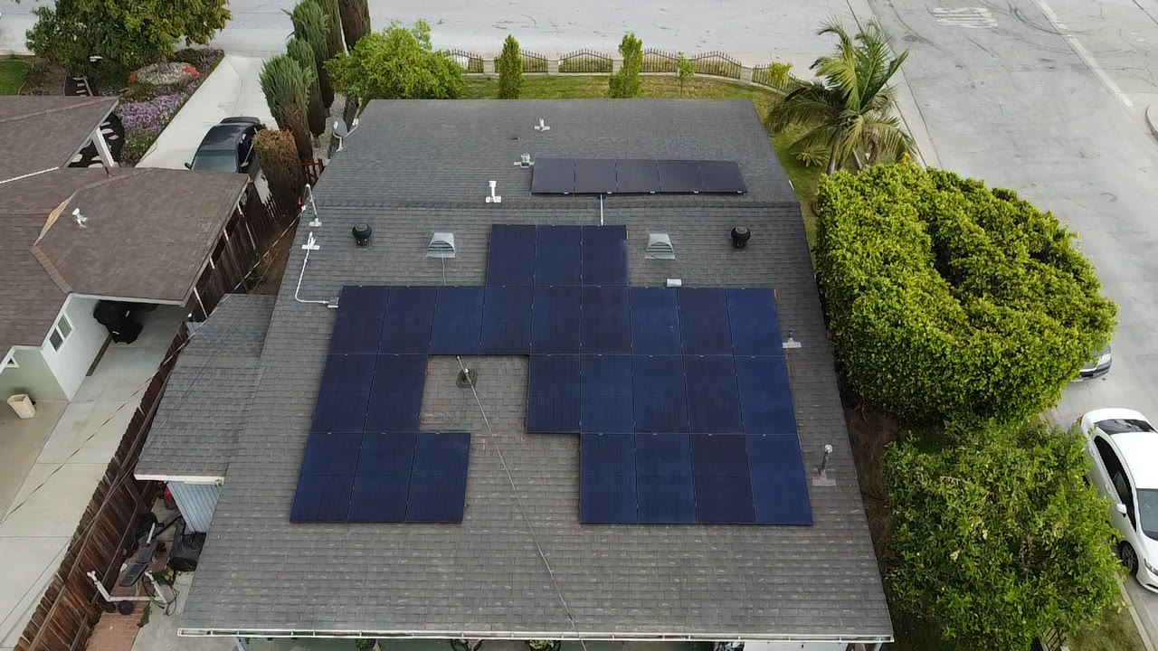 Large black solar array on a new composition shingle roof